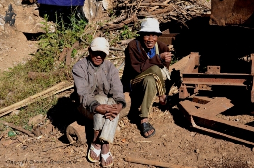 Two miners taking a break from ruby mining at Ah-Sein-Taw, Mogok