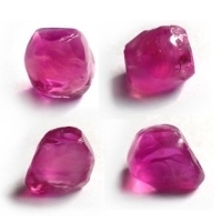 A thirteen carat rough pink sapphire crystal, viewed from four different angles.